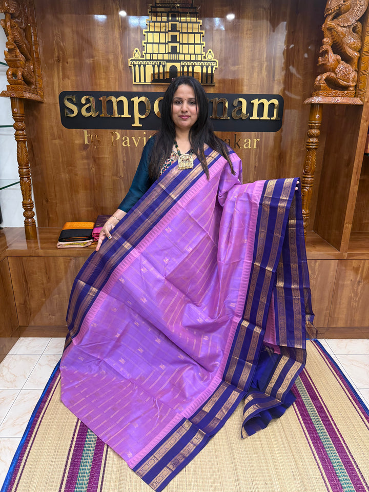 Lavender with Blue , Zari Checks with Mayil and Chakram rich Butta  in the body and rettapet border , rich Pallu Korvai Silk Cotton Saree