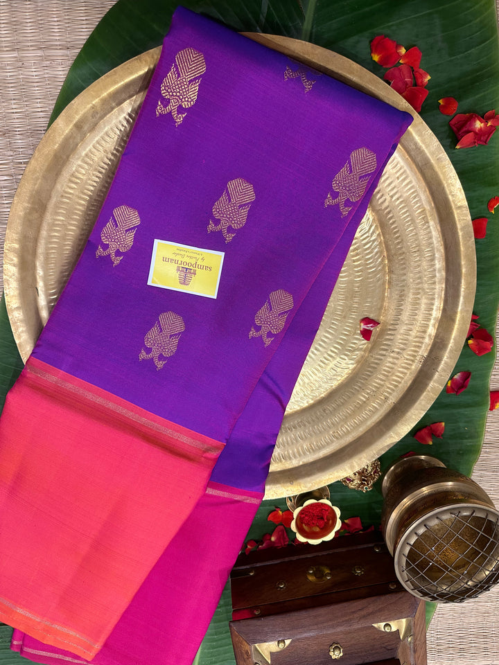 A Classic Mubbagam in Purple Orange and Magenta Shade with the Gandaberundu Zari motif in the Body and Rich Kili Motif in the Pallu Pure Kanjivaram Silk Saree