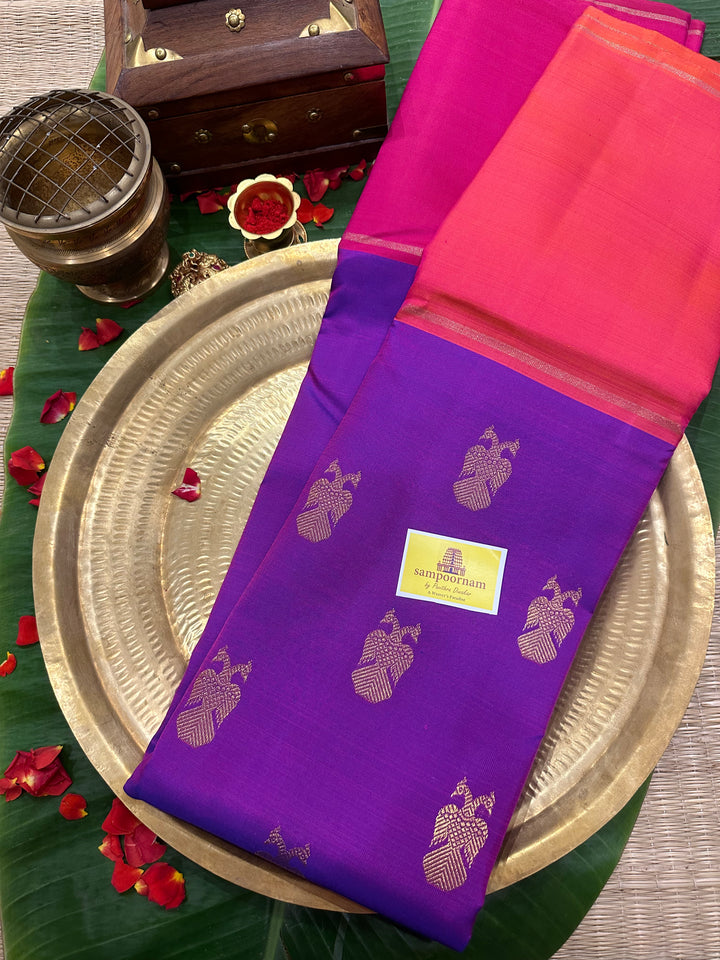 A Classic Mubbagam in Purple Orange and Magenta Shade with the Gandaberundu Zari motif in the Body and Rich Kili Motif in the Pallu Pure Kanjivaram Silk Saree