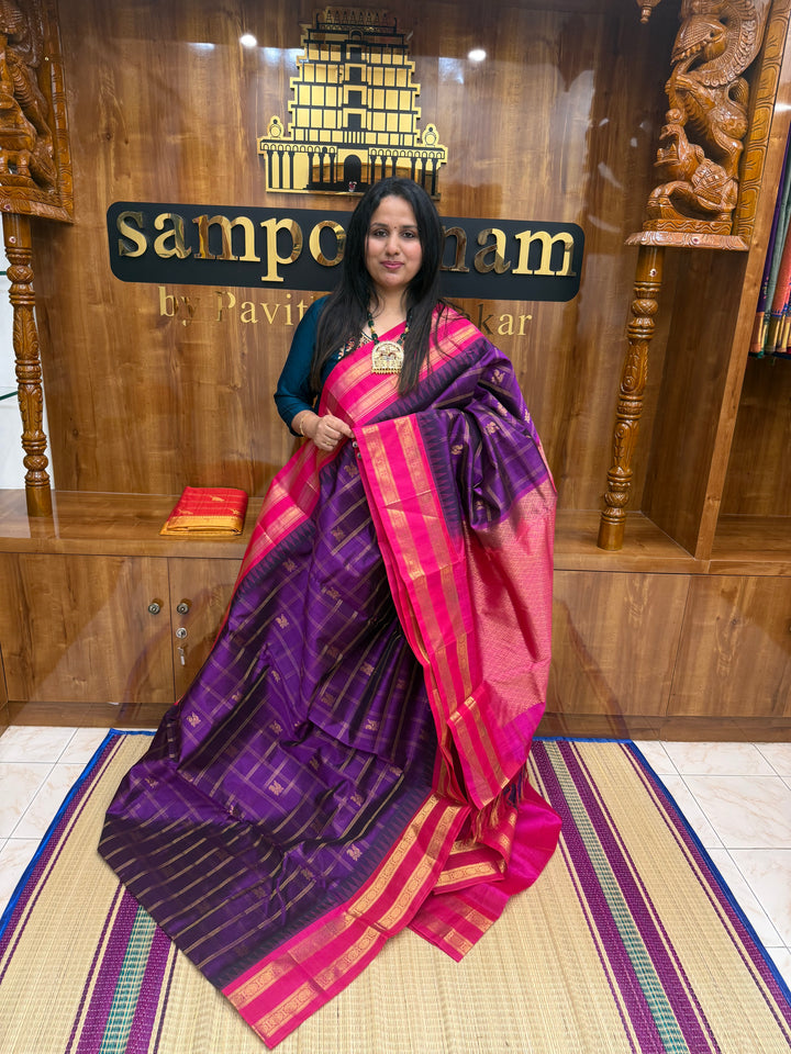 Vadamalli with Magenta , Zari Checks with Mayil and Chakram rich Butta  in the body and rettapet border , rich Pallu Korvai Silk Cotton Saree