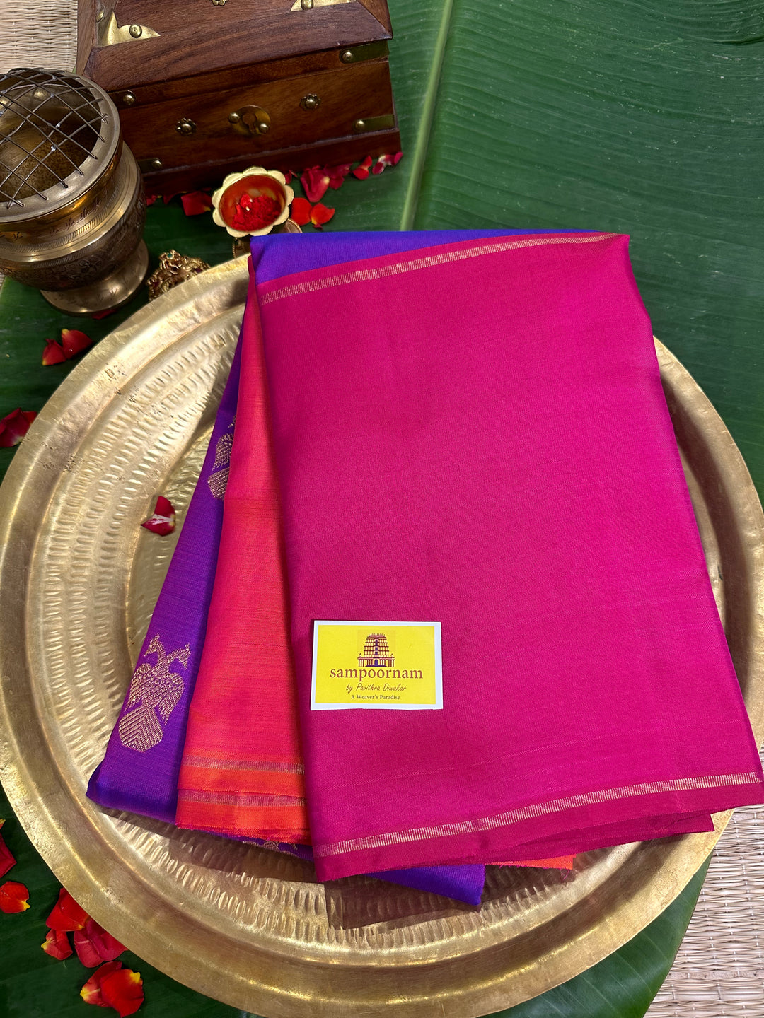 A Classic Mubbagam in Purple Orange and Magenta Shade with the Gandaberundu Zari motif in the Body and Rich Kili Motif in the Pallu Pure Kanjivaram Silk Saree