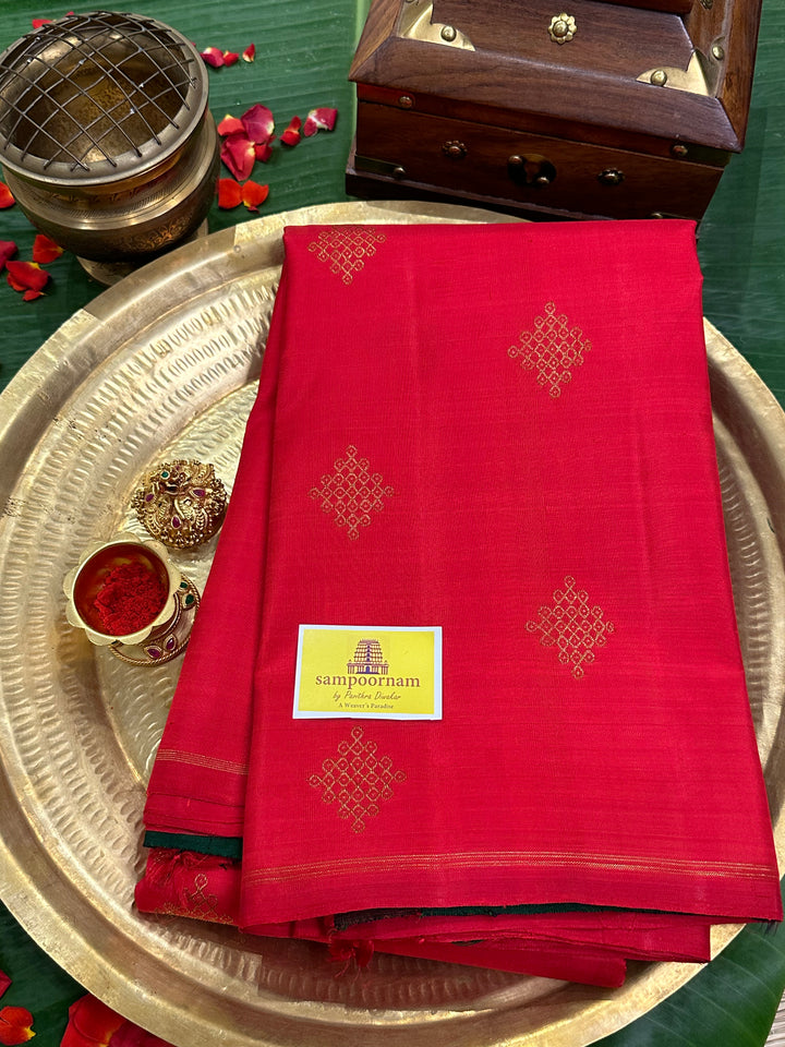 A Beautiful Red with Dark Green , Kolam Zari Motif in the Body and Rich Grand Pallu Pure Kanjivaram Silk Saree