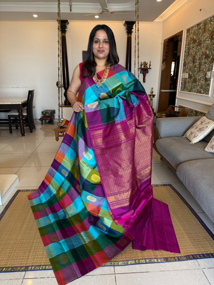 A Vintage with a twist, A Borderless Pallum Pazham Kattam Saree, in Shades Of Blue, Purple, Green, Pink and Orange with Zari Butta in the Body, Rich Traditional Pallu, Pure Kanjivaram Silk Saree
