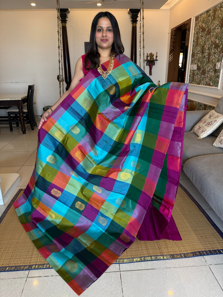 A Vintage with a twist, A Borderless Pallum Pazham Kattam Saree, in Shades Of Blue, Purple, Green, Pink and Orange with Zari Butta in the Body, Rich Traditional Pallu, Pure Kanjivaram Silk Saree