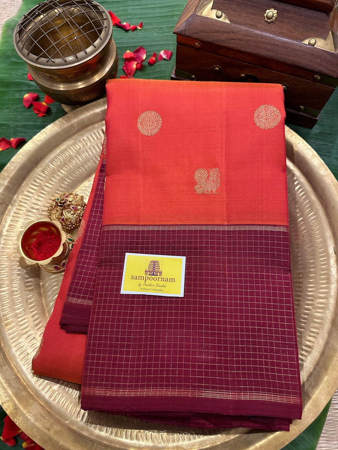 A Traditional Dark orange with Araku , Zari Checks Border , Mayil Chakram Zari Butta in Body and Traditional Rich Pallu Pure Kanjivaram Silk Saree