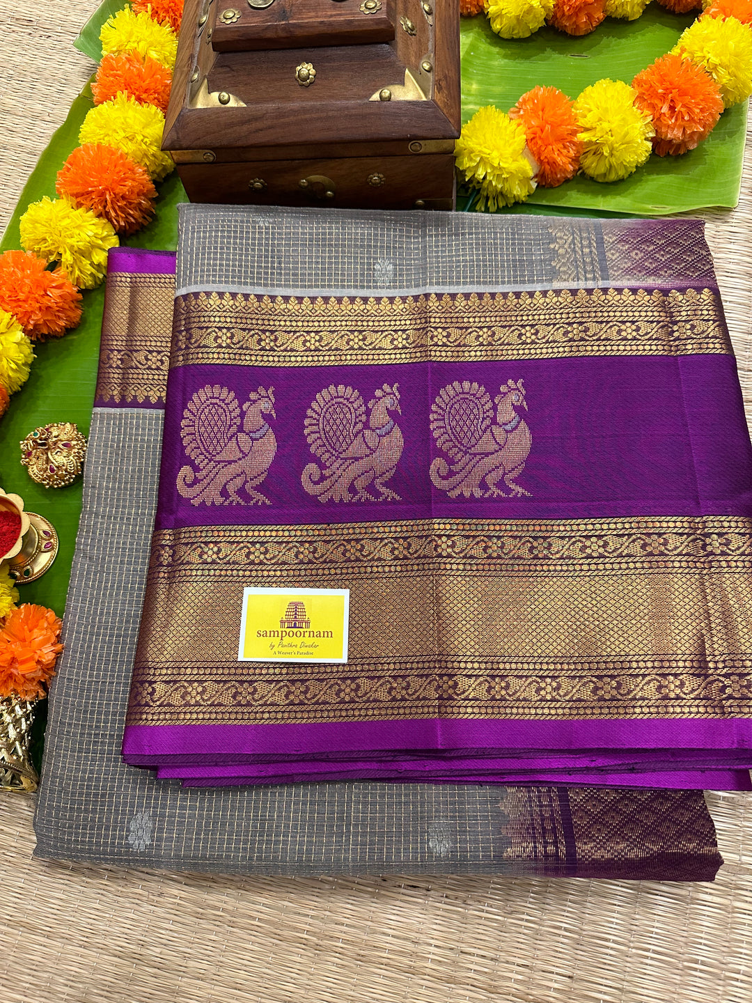 Grey with Purple Podi Kattam with Silver Butta in The Body and Satin Peacock Motif Border and Rich Pallu Korvai Silk Cotton Saree