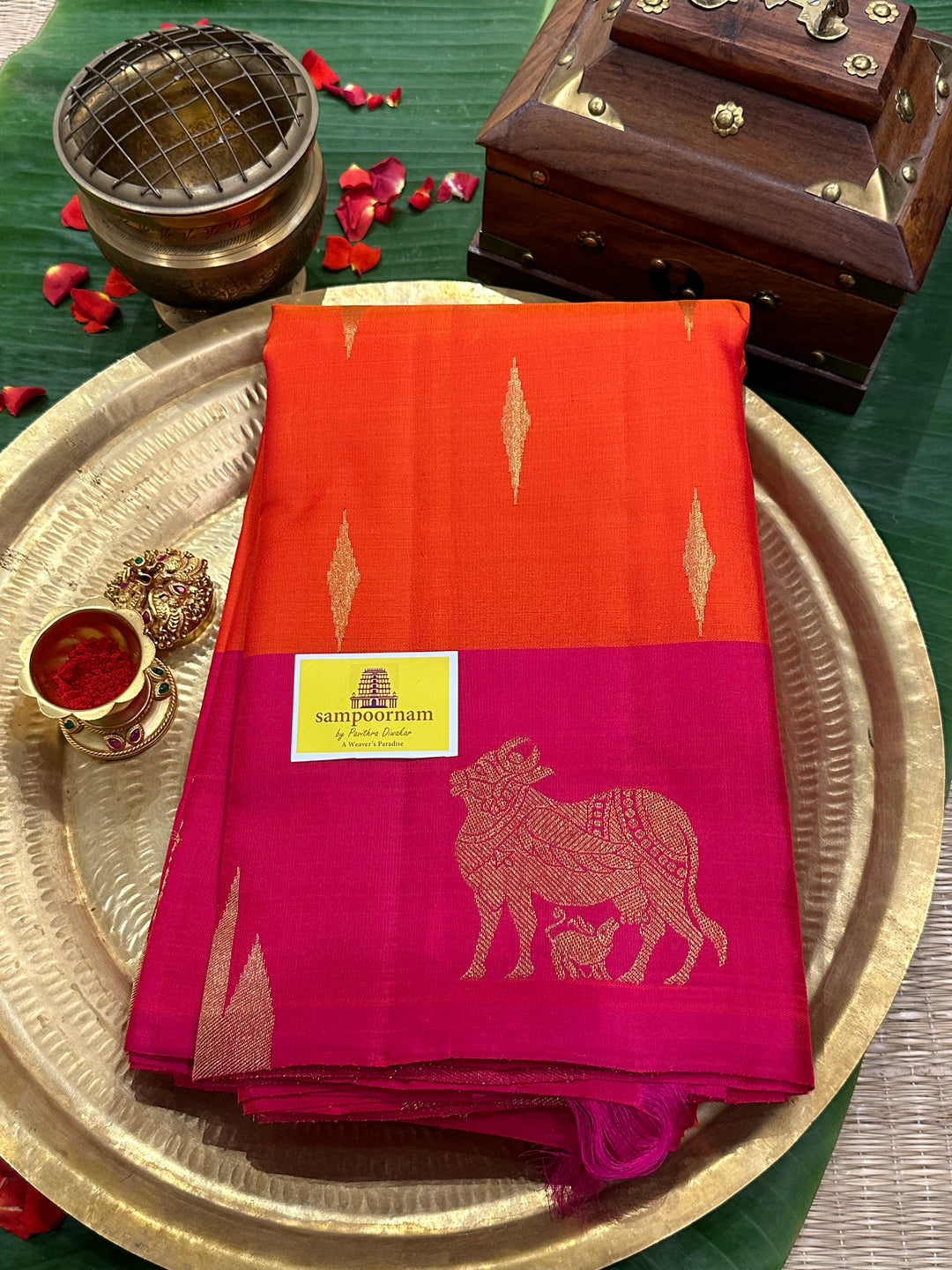 A Beautiful Orange with Dark pink with Traditional Temple, Gomatha and Kodi Zari Motif in Border and Rich pallu , Pure Kanjivaram Silk Saree