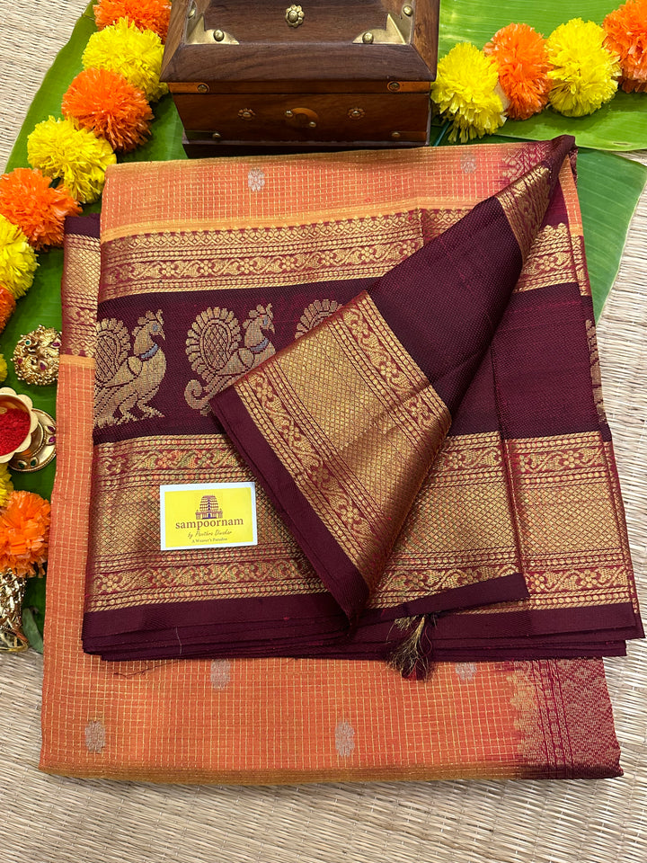 Orange with Araku Podi Kattam with Silver Butta in The Body and Satin Peacock Motif Border and Rich Pallu Korvai Silk Cotton Saree