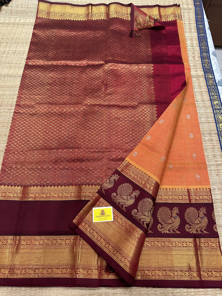 Orange with Araku Podi Kattam with Silver Butta in The Body and Satin Peacock Motif Border and Rich Pallu Korvai Silk Cotton Saree