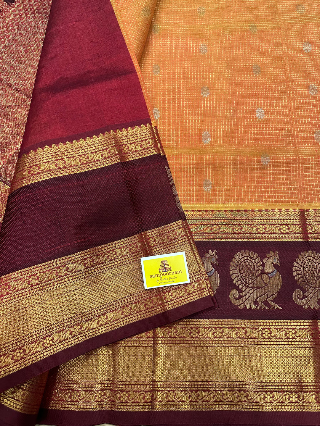 Orange with Araku Podi Kattam with Silver Butta in The Body and Satin Peacock Motif Border and Rich Pallu Korvai Silk Cotton Saree