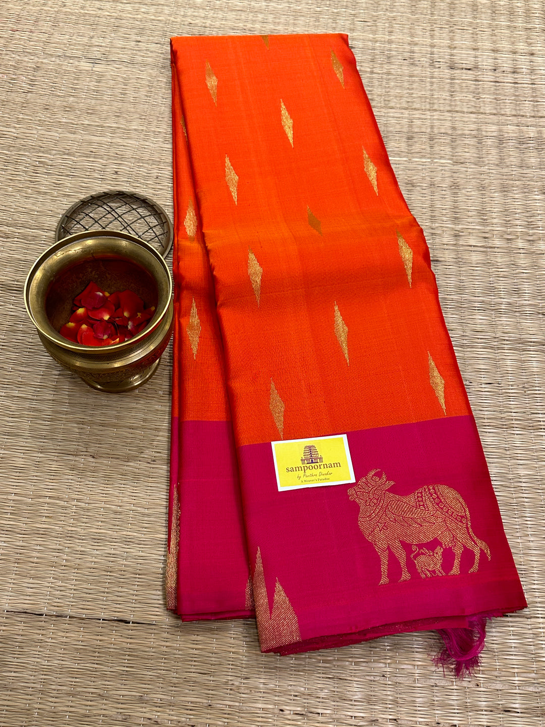 A Beautiful Orange with Dark pink with Traditional Temple, Gomatha and Kodi Zari Motif in Border and Rich pallu , Pure Kanjivaram Silk Saree