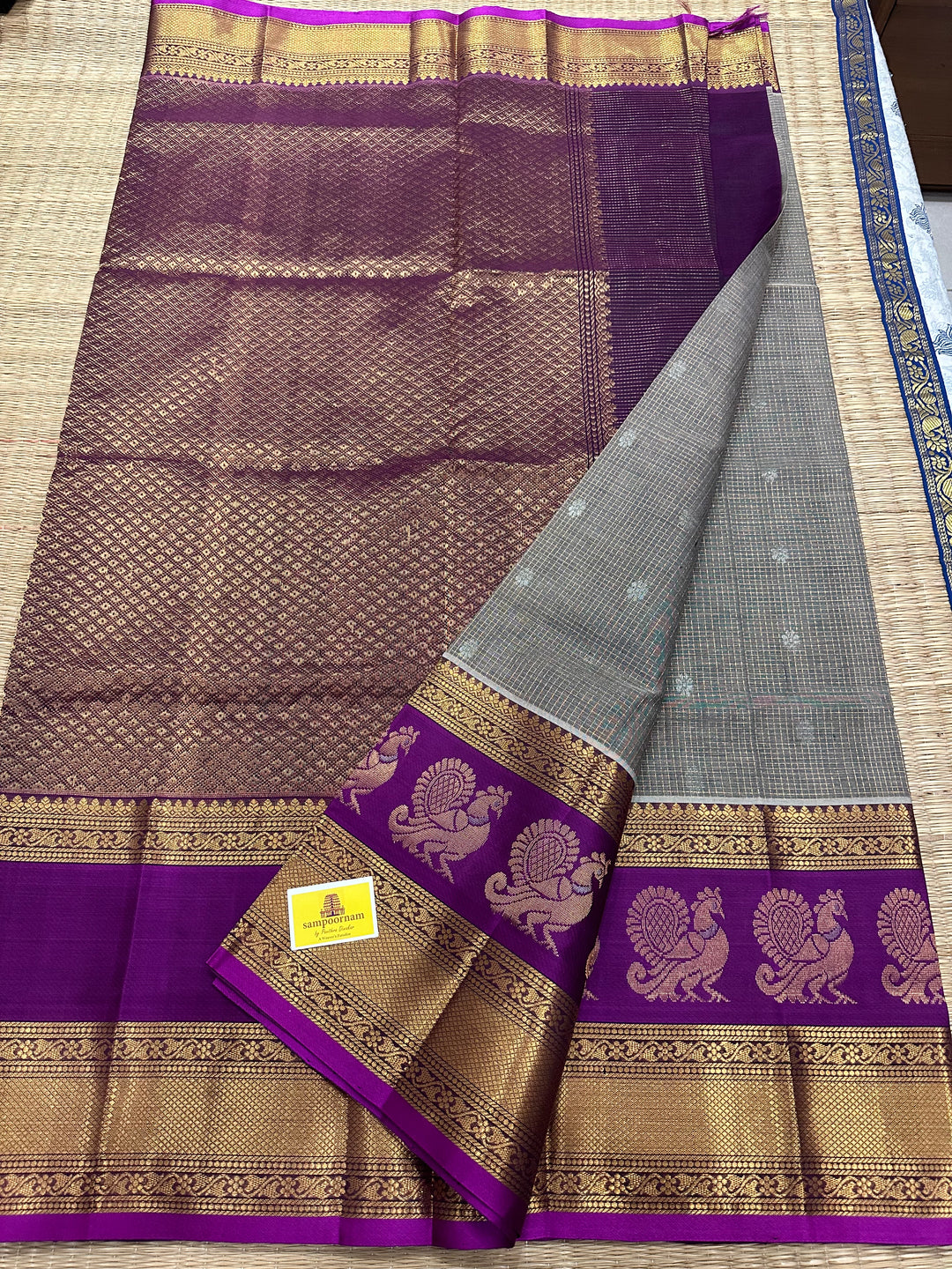 Grey with Purple Podi Kattam with Silver Butta in The Body and Satin Peacock Motif Border and Rich Pallu Korvai Silk Cotton Saree