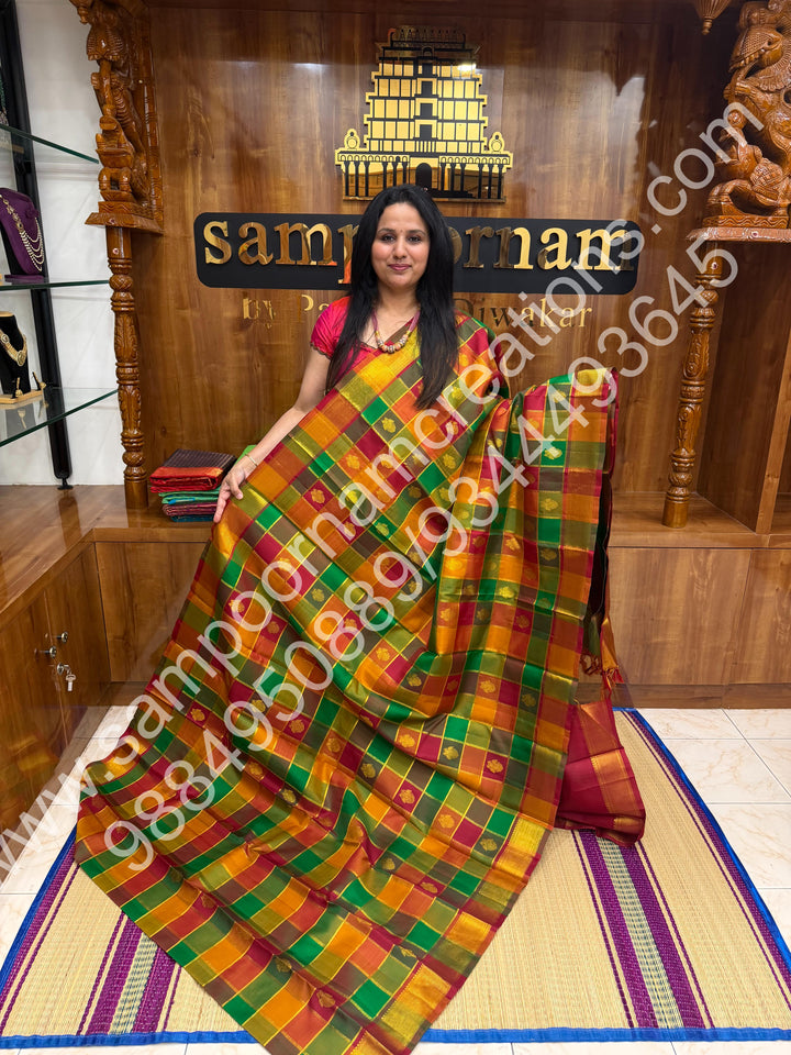 Green , Orange , Mustard and Maroon with Maroon , Rich Two side Peacock butta in the body with Zari checks , Traditional borders and Rich Pallu , Pure Kanjivaram Silk Saree