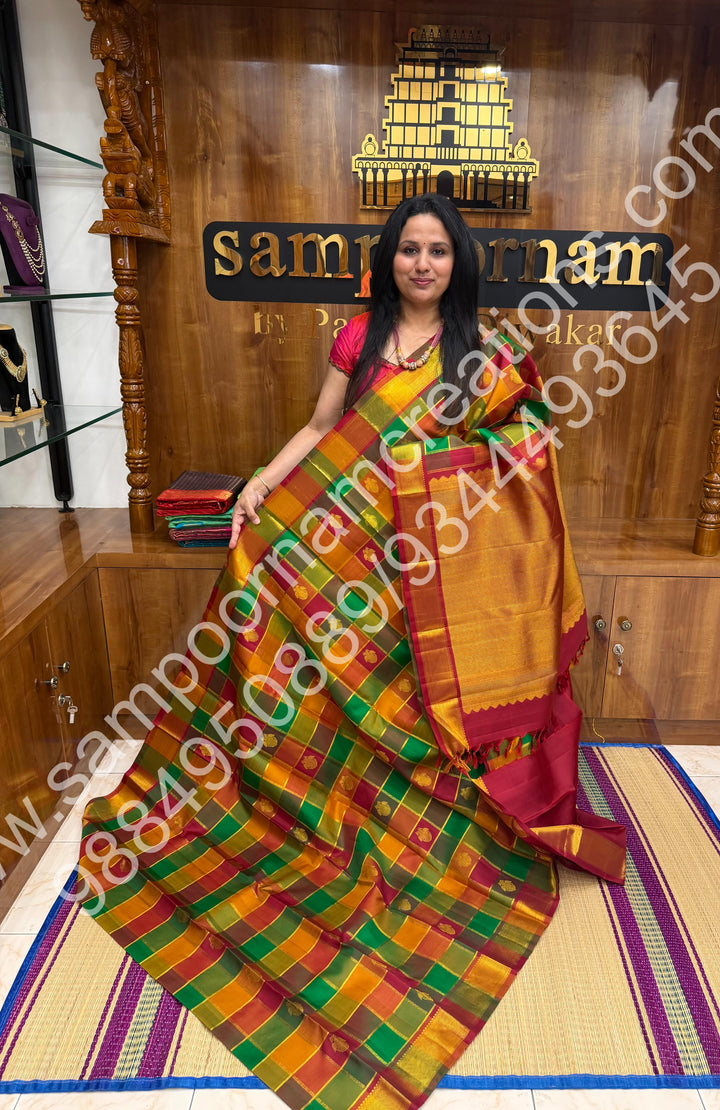 Green , Orange , Mustard and Maroon with Maroon , Rich Two side Peacock butta in the body with Zari checks , Traditional borders and Rich Pallu , Pure Kanjivaram Silk Saree