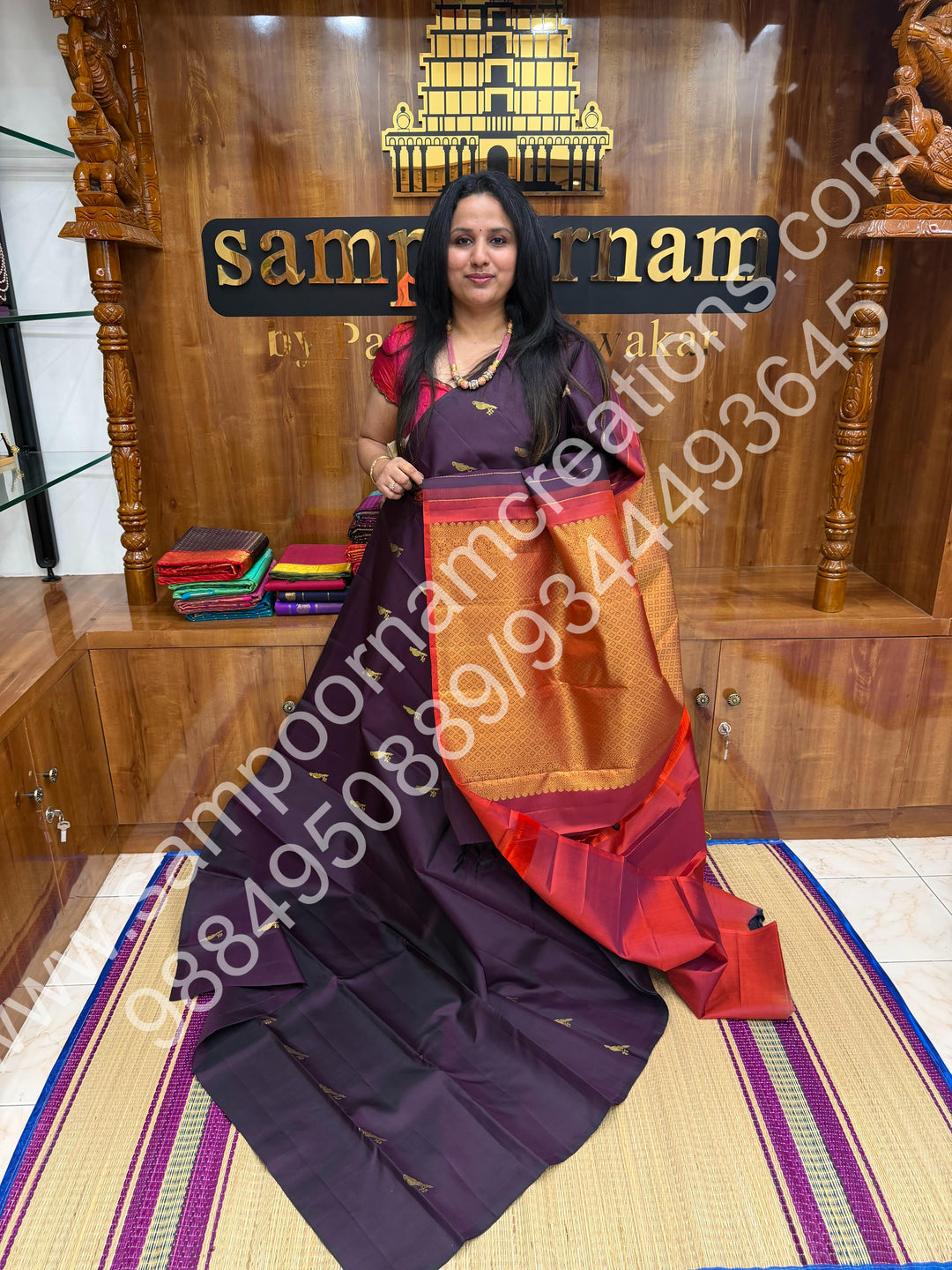 Dark Jamun with Rust Orange , Rich Parrot Zari  butta in the body  and  a Rich Pallu , Pure Kanjivaram Silk Saree
