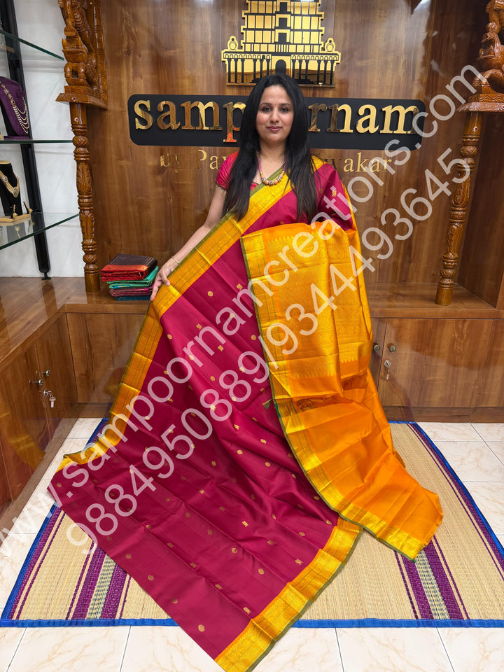Kumkum Red with Mustard , Rich Mayil and Chakram  butta in the body , Traditional borders and Rich Pallu , Pure Kanjivaram Silk Saree