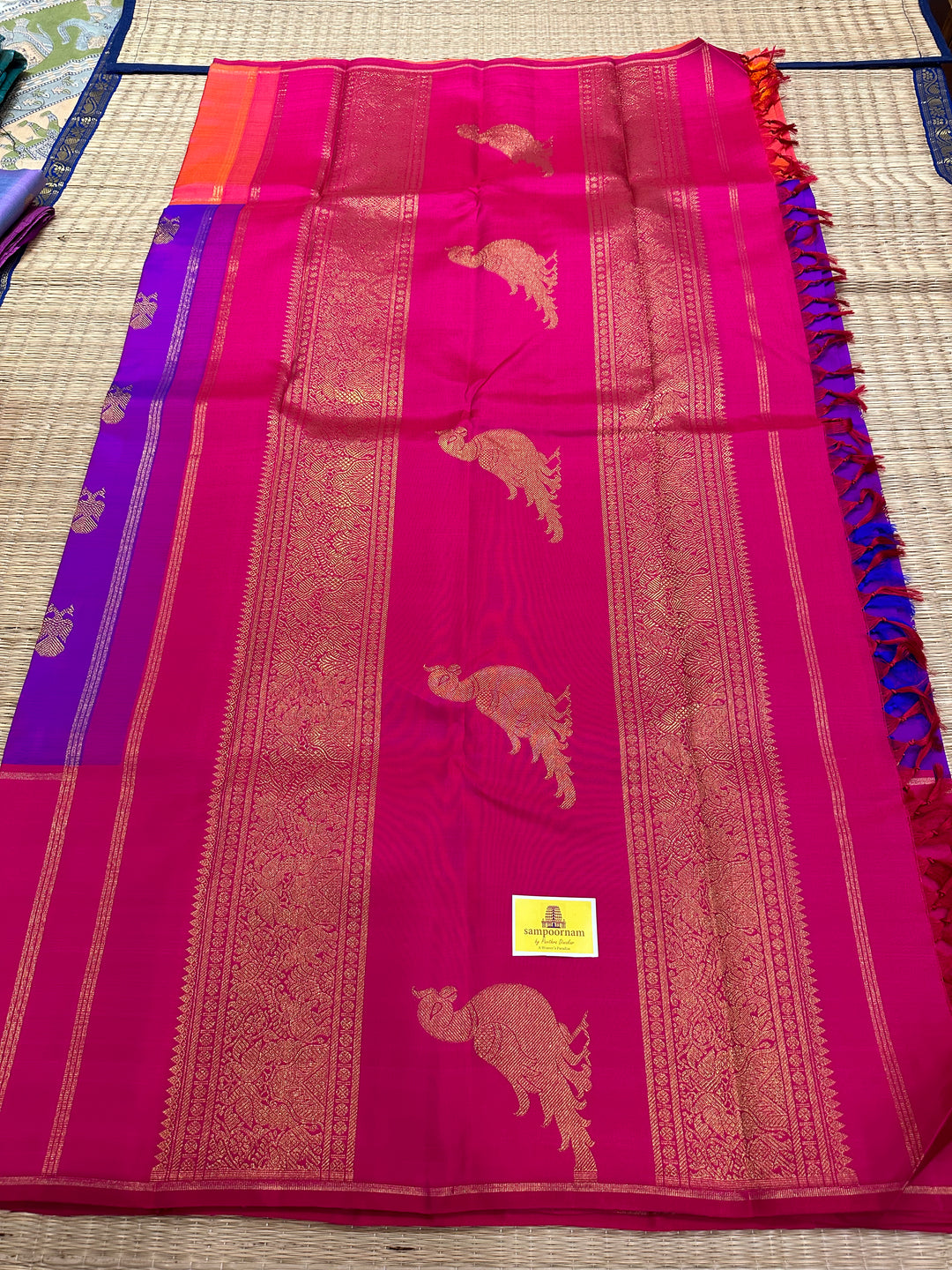 A Classic Mubbagam in Purple Orange and Magenta Shade with the Gandaberundu Zari motif in the Body and Rich Kili Motif in the Pallu Pure Kanjivaram Silk Saree