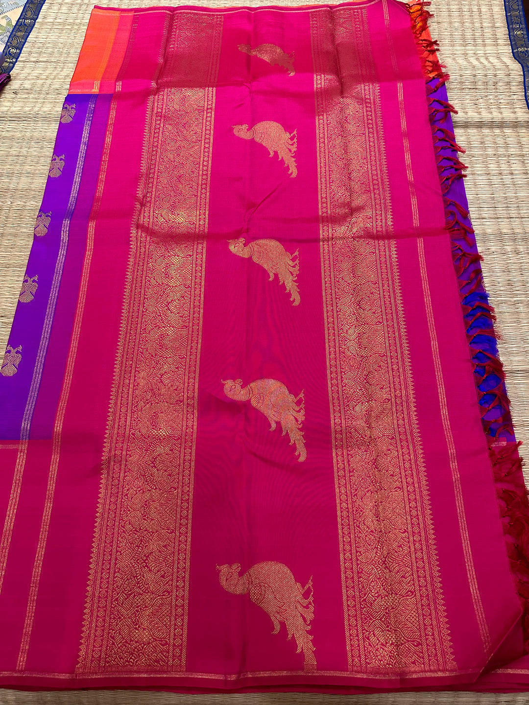 A Classic Mubbagam in Purple Orange and Magenta Shade with the Gandaberundu Zari motif in the Body and Rich Kili Motif in the Pallu Pure Kanjivaram Silk Saree