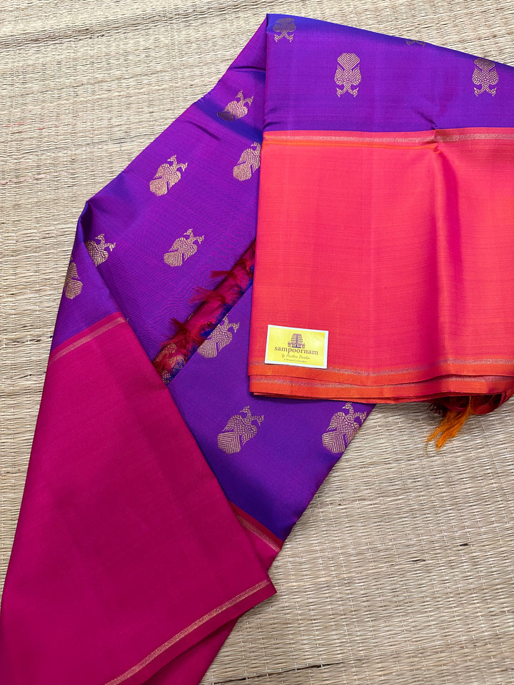 A Classic Mubbagam in Purple Orange and Magenta Shade with the Gandaberundu Zari motif in the Body and Rich Kili Motif in the Pallu Pure Kanjivaram Silk Saree