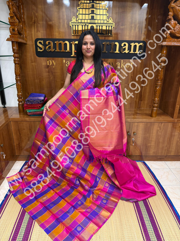 Pink , Purple , Mustard , Orange with Pink , Rich Mayil and Chakram  butta in the body with Zari checks , Traditional borders and Rich Pallu , Pure Kanjivaram Silk Saree
