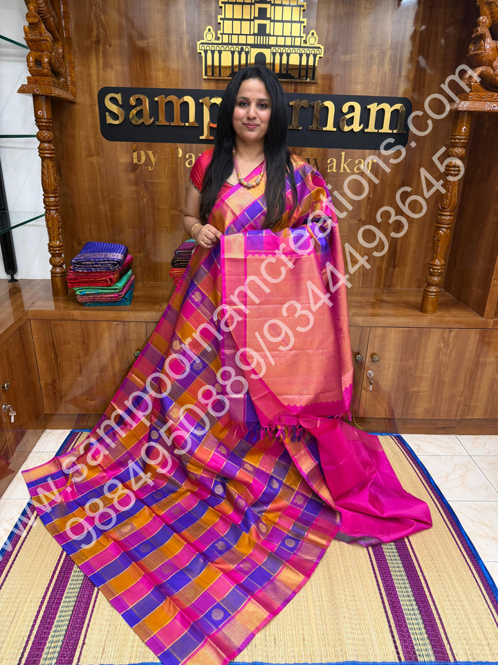 Pink , Purple , Mustard , Orange with Pink , Rich Mayil and Chakram  butta in the body with Zari checks , Traditional borders and Rich Pallu , Pure Kanjivaram Silk Saree