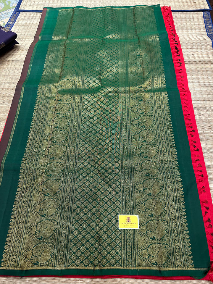 A Beautiful Red with Dark Green , Kolam Zari Motif in the Body and Rich Grand Pallu Pure Kanjivaram Silk Saree