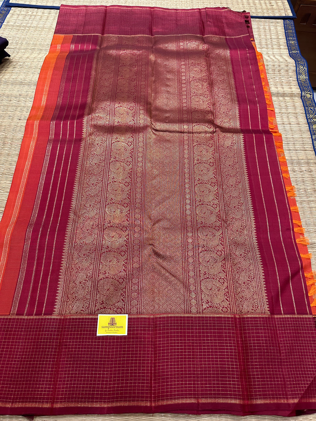 A Traditional Dark orange with Araku , Zari Checks Border , Mayil Chakram Zari Butta in Body and Traditional Rich Pallu Pure Kanjivaram Silk Saree