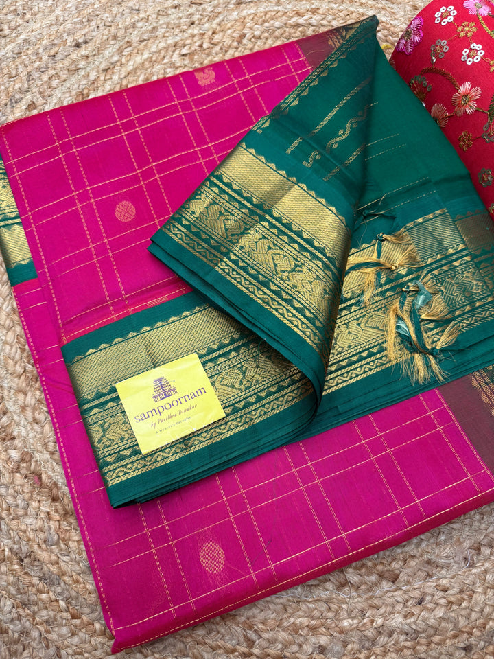 Pink with Green , rich Zari checks with Mayil Chakram butta in the body , rich Pallu Korvai Silk Cotton Saree