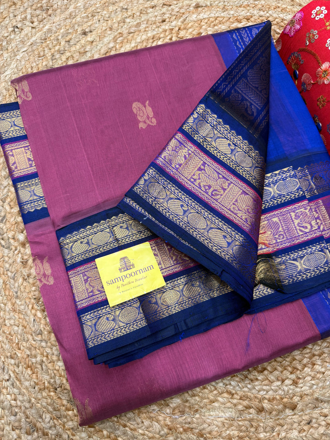 Mauve with Blue , rich Zari Mango  butta in the body , Traditional Kanchi borders and  rich Pallu Silk Cotton Saree