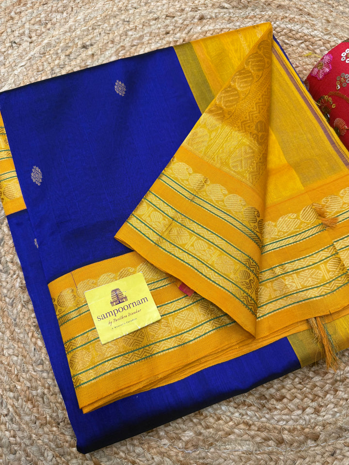 Royal Blue with Manjal , rich  Zari Butta in the body , Rettapet borders and rich Pallu Korvai Silk Cotton Saree