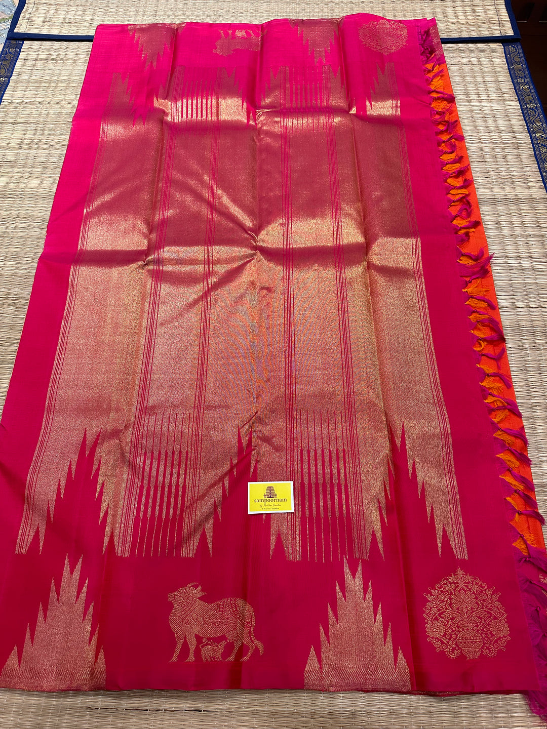 A Beautiful Orange with Dark pink with Traditional Temple, Gomatha and Kodi Zari Motif in Border and Rich pallu , Pure Kanjivaram Silk Saree