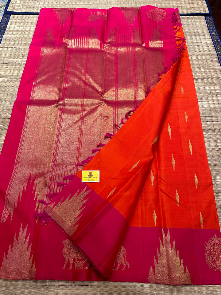 A Beautiful Orange with Dark pink with Traditional Temple, Gomatha and Kodi Zari Motif in Border and Rich pallu , Pure Kanjivaram Silk Saree