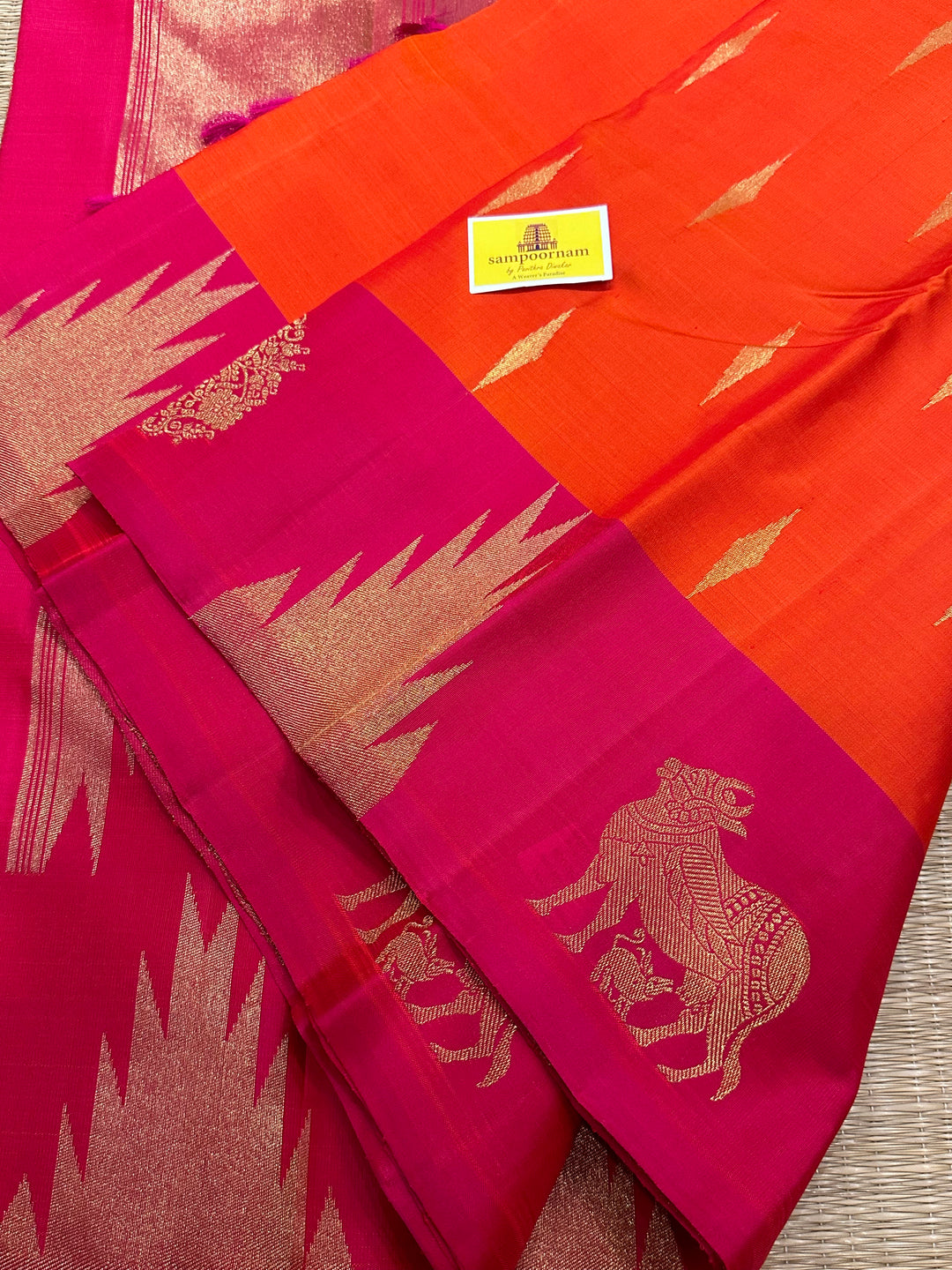 A Beautiful Orange with Dark pink with Traditional Temple, Gomatha and Kodi Zari Motif in Border and Rich pallu , Pure Kanjivaram Silk Saree