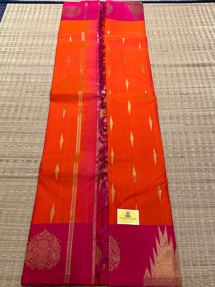 A Beautiful Orange with Dark pink with Traditional Temple, Gomatha and Kodi Zari Motif in Border and Rich pallu , Pure Kanjivaram Silk Saree