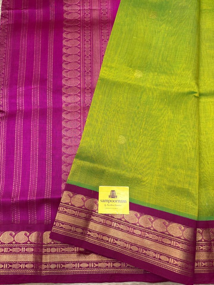 Parrot Green with Pink , rich Mango Zari Butta in the body , traditional borders and rich Pallu Korvai Silk Cotton Saree
