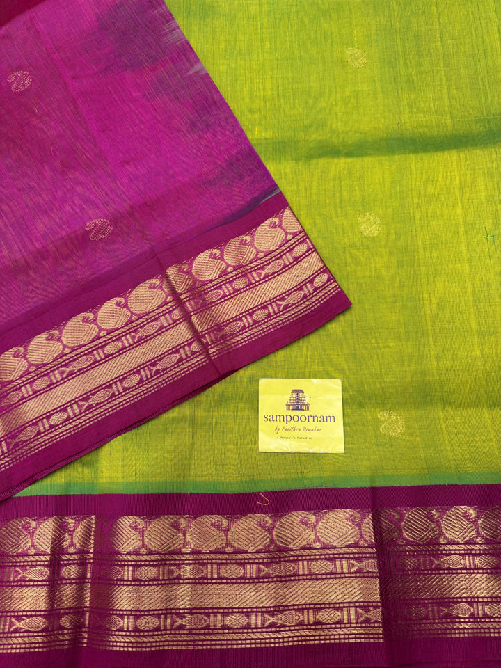 Parrot Green with Pink , rich Mango Zari Butta in the body , traditional borders and rich Pallu Korvai Silk Cotton Saree