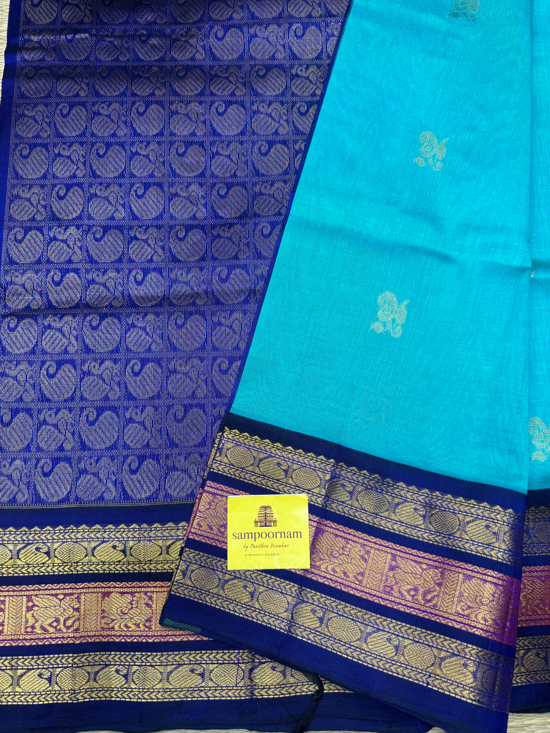 Ramar Blue  with Dark Blue , rich Mango Zari Butta in the body , traditional Kanchi borders and rich Pallu Korvai Silk Cotton Saree
