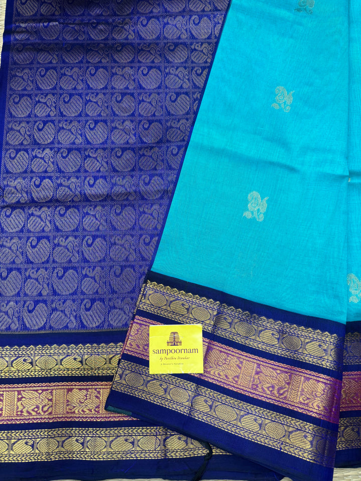 Ramar Blue  with Dark Blue , rich Mango Zari Butta in the body , traditional Kanchi borders and rich Pallu Korvai Silk Cotton Saree