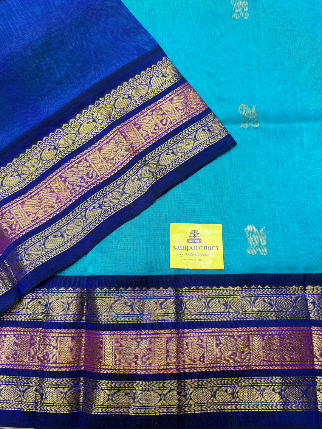 Ramar Blue  with Dark Blue , rich Mango Zari Butta in the body , traditional Kanchi borders and rich Pallu Korvai Silk Cotton Saree