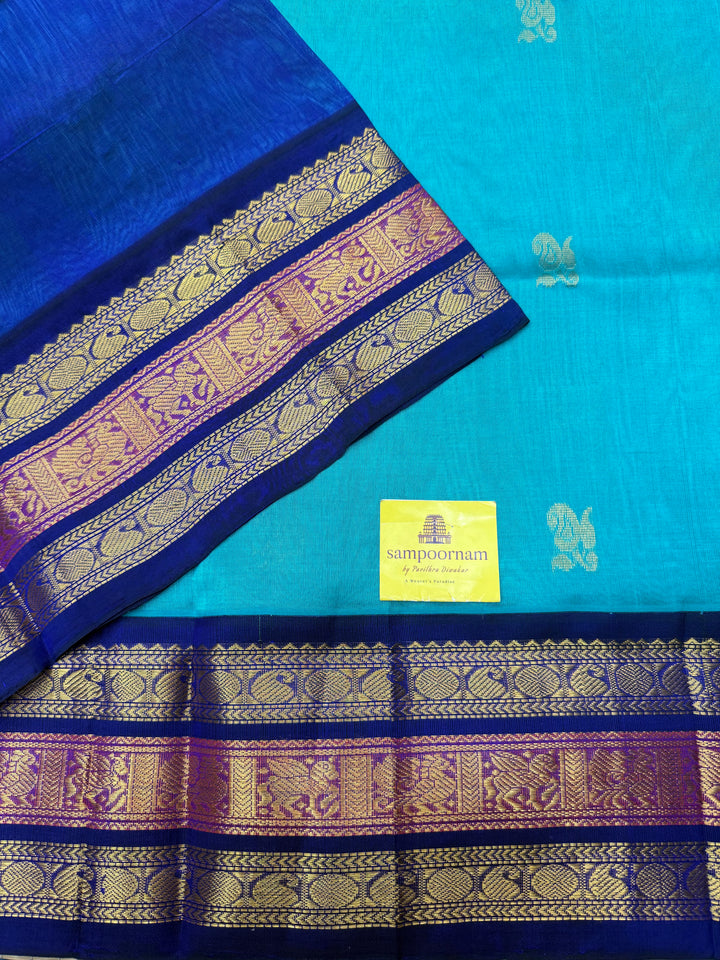 Ramar Blue  with Dark Blue , rich Mango Zari Butta in the body , traditional Kanchi borders and rich Pallu Korvai Silk Cotton Saree