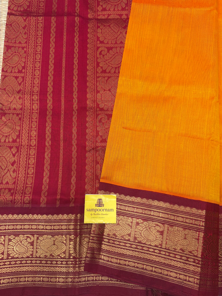 Mambazha Manjal with Kumkum Red  , Traditional Big Kanchi Borders and rich Pallu Korvai Silk Cotton Saree