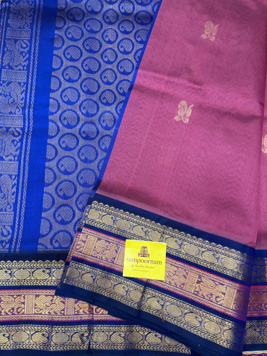 Mauve with Blue , rich Zari Mango  butta in the body , Traditional Kanchi borders and  rich Pallu Silk Cotton Saree