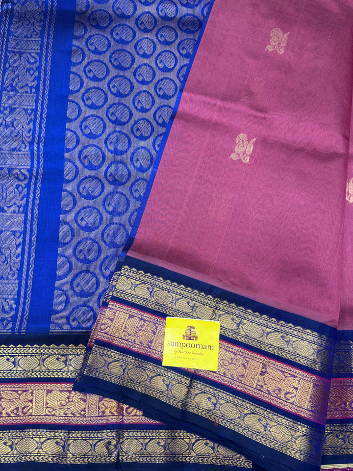 Mauve with Blue , rich Zari Mango  butta in the body , Traditional Kanchi borders and  rich Pallu Silk Cotton Saree