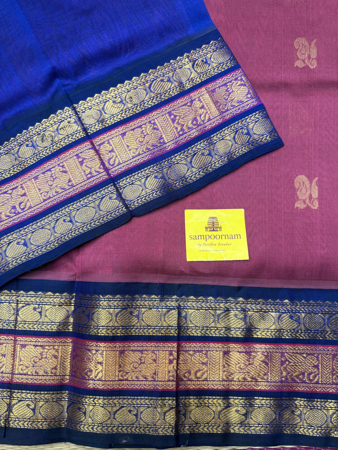 Mauve with Blue , rich Zari Mango  butta in the body , Traditional Kanchi borders and  rich Pallu Silk Cotton Saree