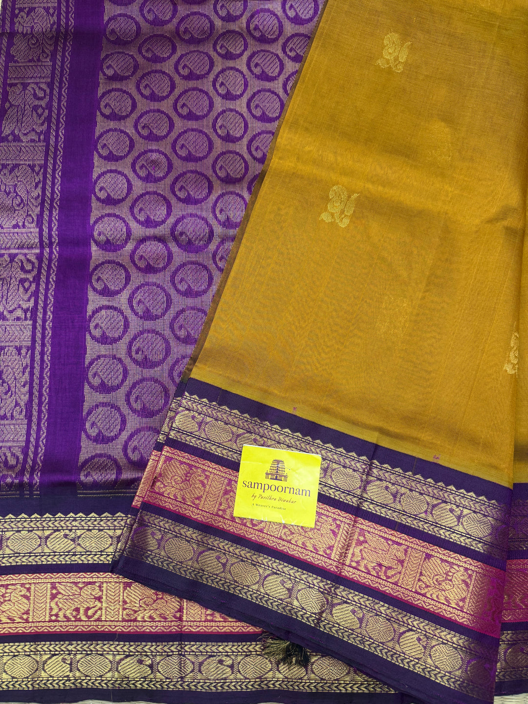 Fenugreek Vendhayam with Purple , rich Mango Zari Butta in the body , traditional Kanchi borders  and rich Pallu Korvai Silk Cotton Saree
