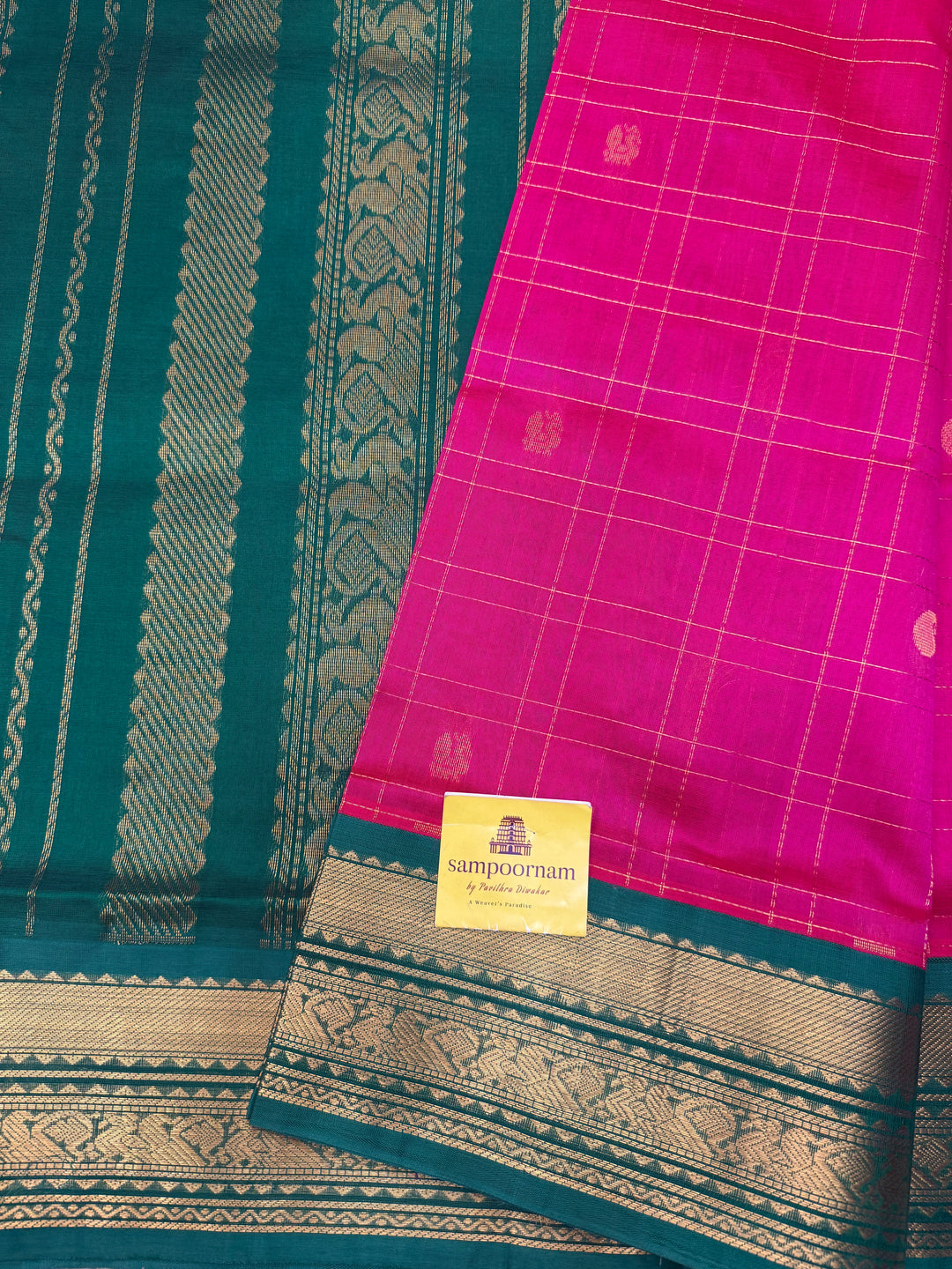 Pink with Green , rich Zari checks with Mayil Chakram butta in the body , rich Pallu Korvai Silk Cotton Saree
