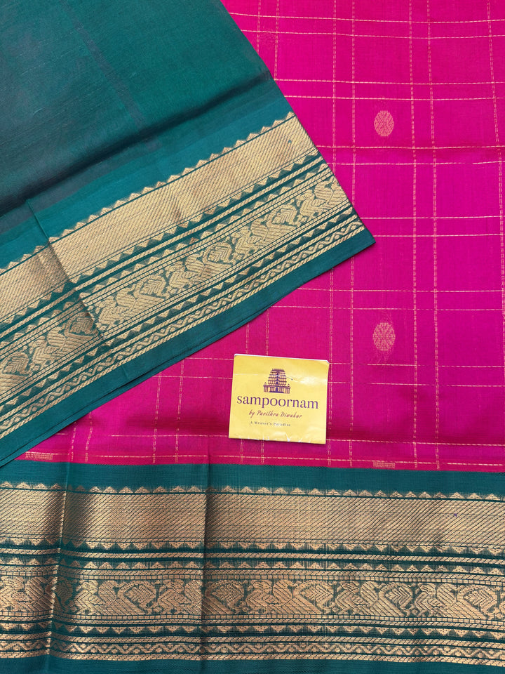 Pink with Green , rich Zari checks with Mayil Chakram butta in the body , rich Pallu Korvai Silk Cotton Saree