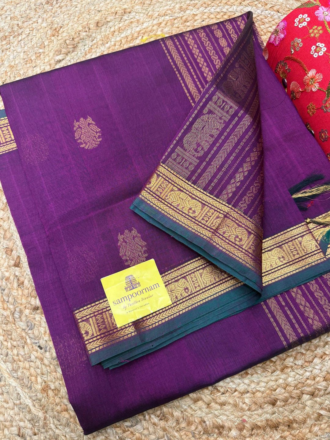 Wine with Green Selvedge , rich two side Peacock Zari butta in the body , Traditional borders rich Pallu Silk Cotton Saree