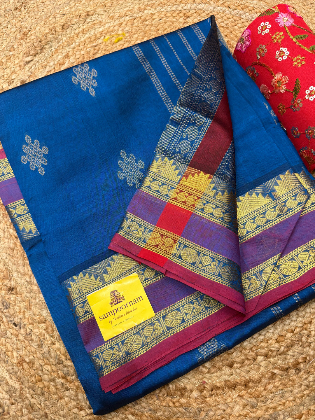 Mayilkazhuthu Blue with Red Selvedge , rich Kolam Zari butta in the body , Rettapet borders and rich Pallu Silk Cotton Saree