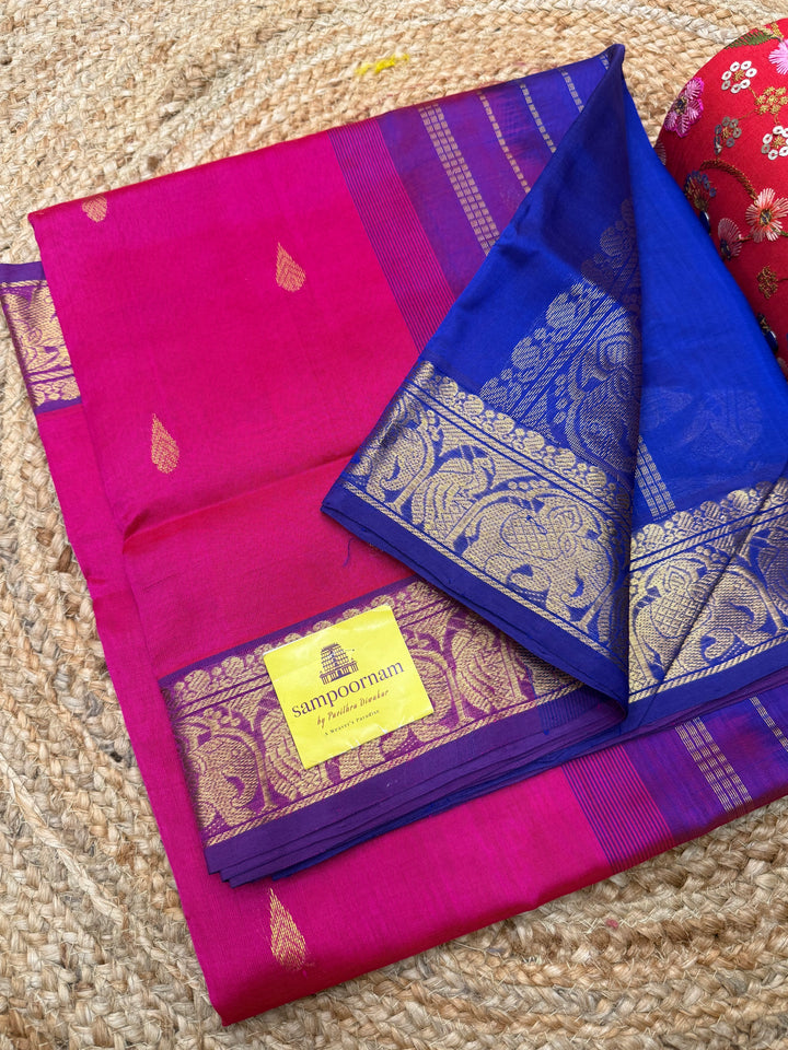 Pink with Indigo Blue  , rich Thilagam Zari butta in the body , Traditional Big Borders and rich Pallu  Silk Cotton Saree